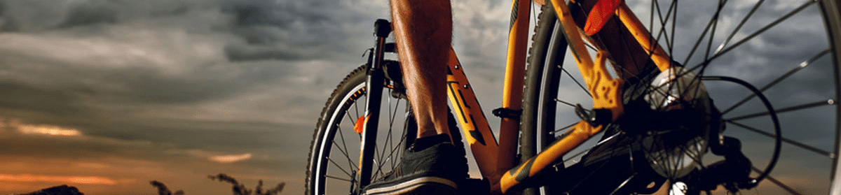 person-riding-a-bike-on-trail